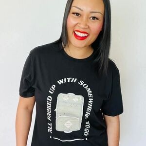 LuLaRoe Rocker Tee Medium NWT “All Packed Up With Somewhere To Go” Black